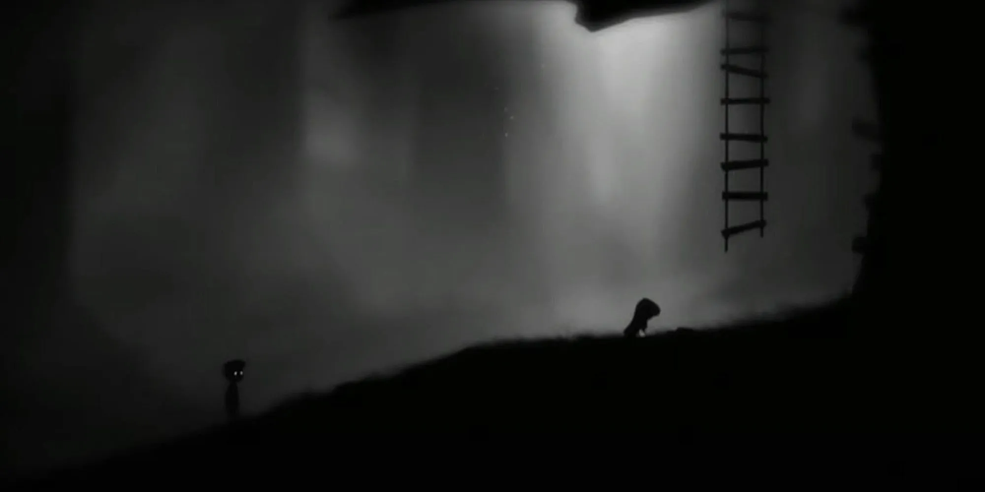 Cậu bé nhân vật chính trong game Limbo đứng giữa khung cảnh u tối, đơn sắc đặc trưng của trò chơi