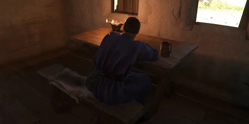 Chernik ngồi trong quán rượu ở Bylany, một manh mối quan trọng trong nhiệm vụ Di Sản KCD2.
