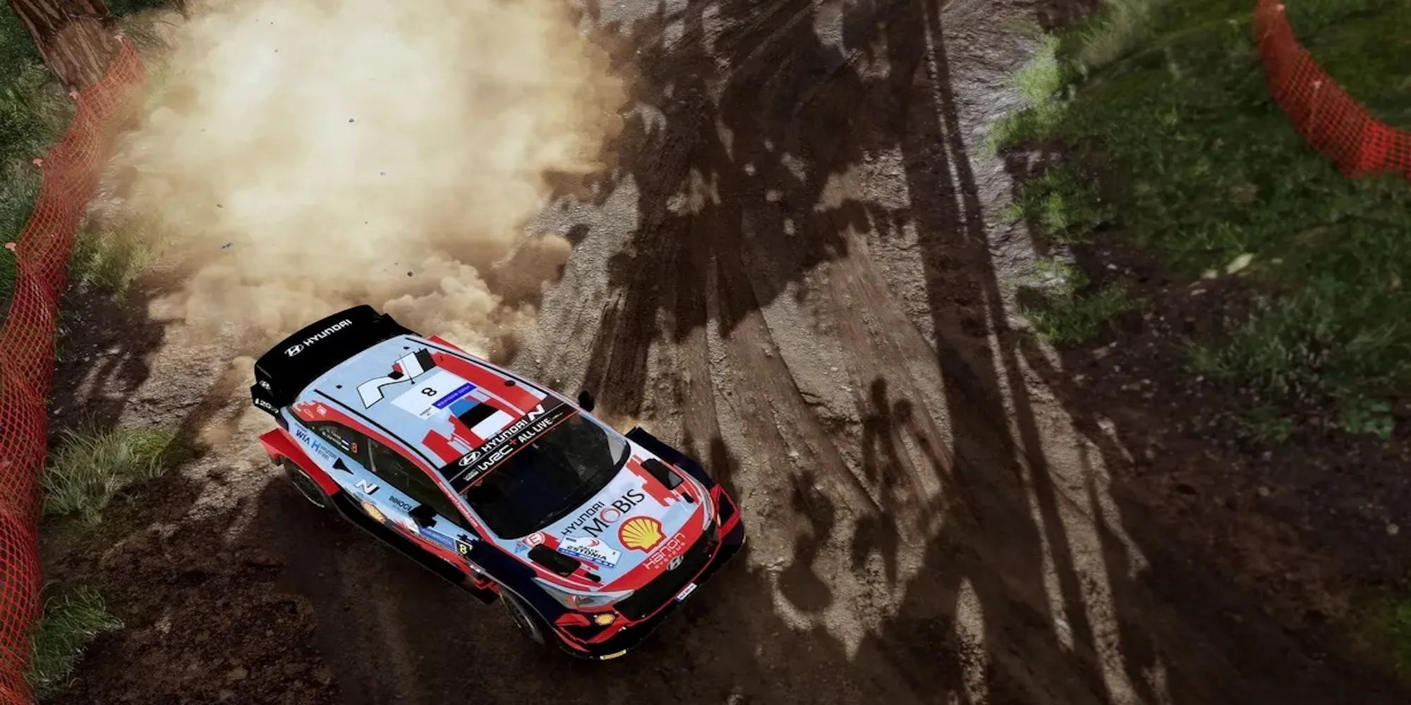 Chiếc xe đua WRC 10 đang thực hiện cú drift trên đường đất