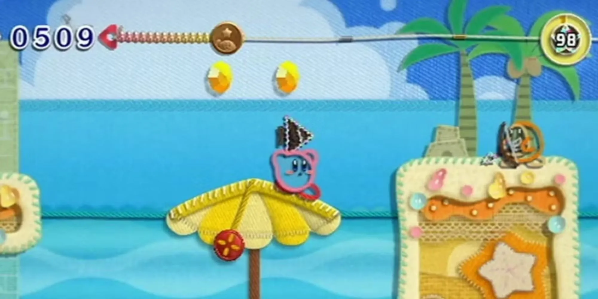 Kirby nhắm vào một Waddle Dee cung thủ trong Kirby's Epic Yarn.