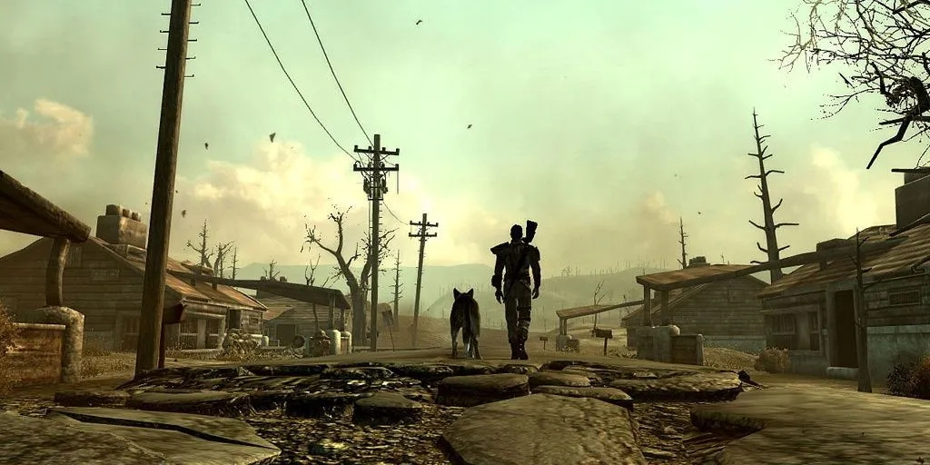 Nhân vật chính và chú chó Dogmeat đang đi dạo trên con đường ở Capital Wasteland trong Fallout 3