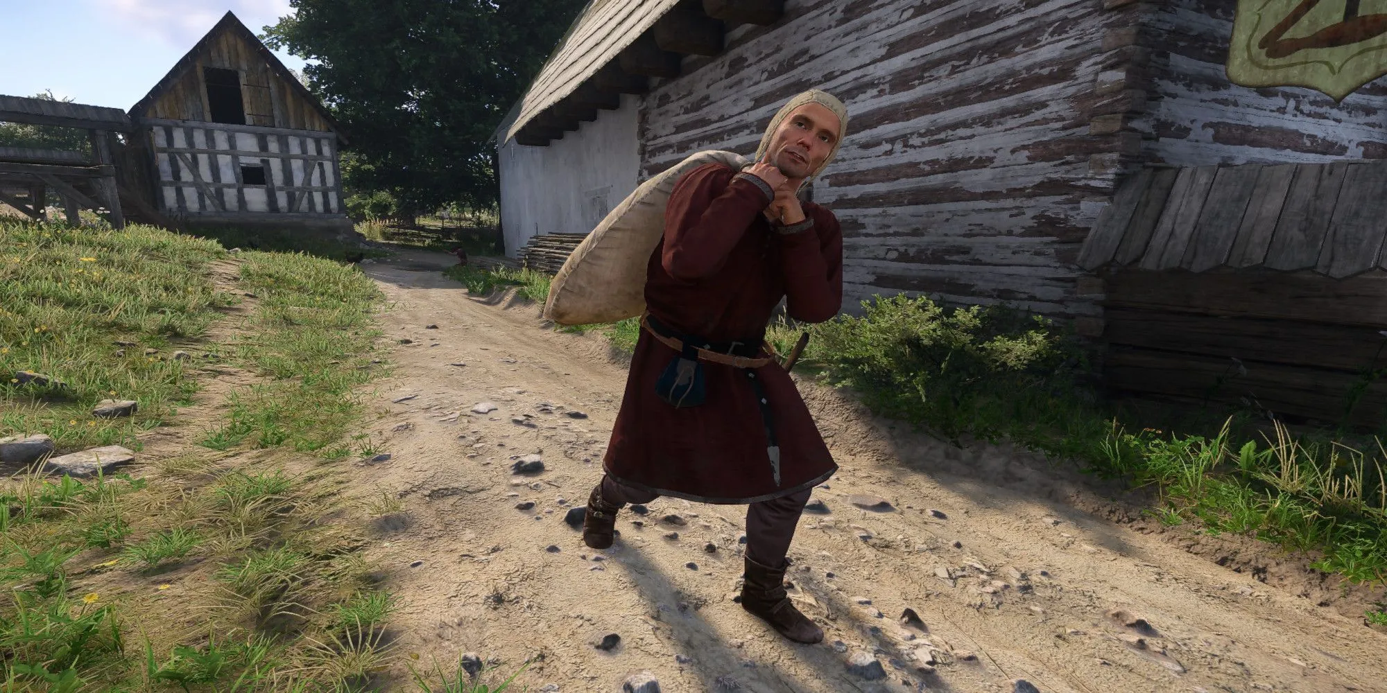 Nhân vật vận chuyển chiến lợi phẩm trong game Kingdom Come Deliverance 2