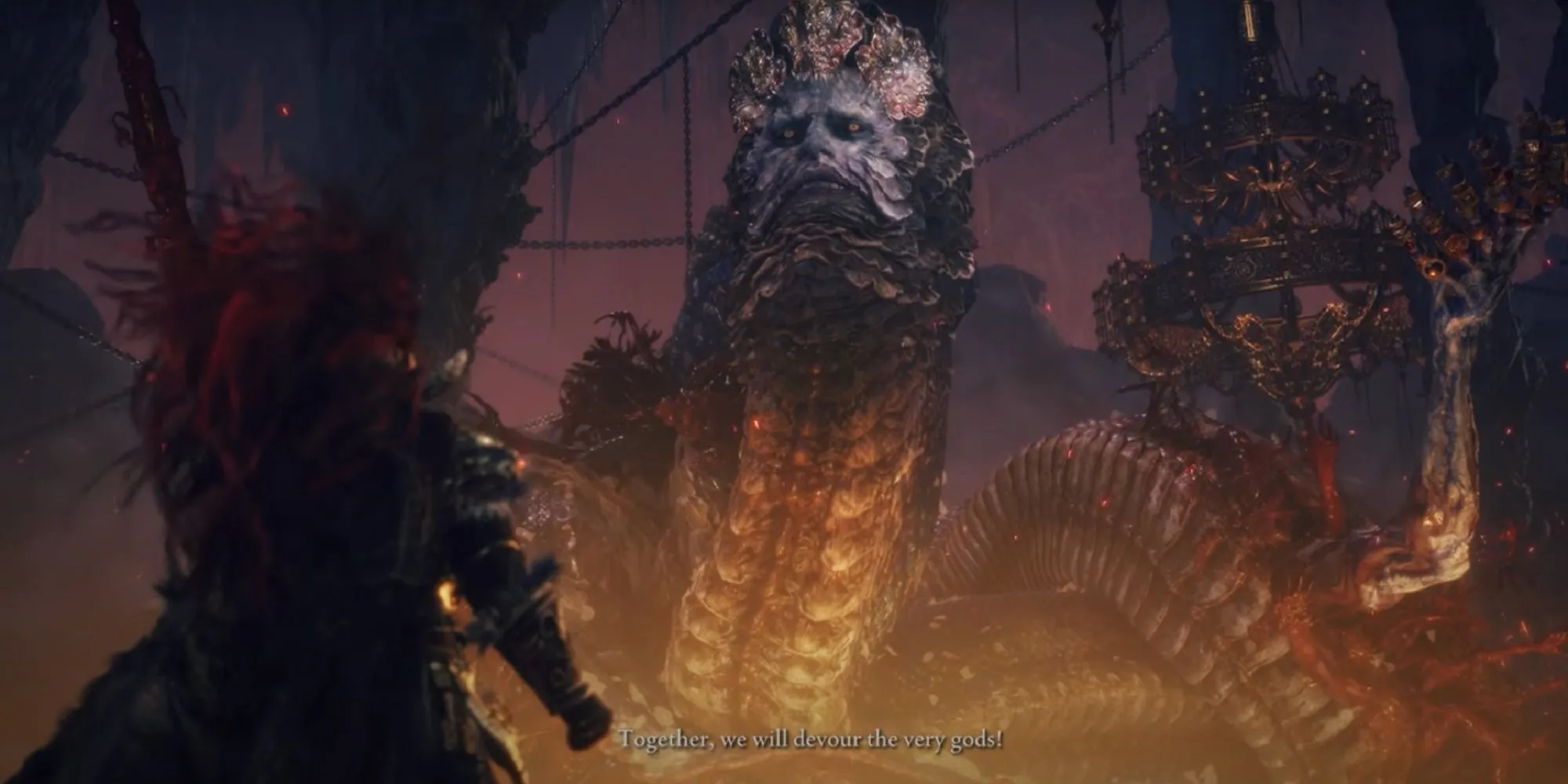 Rykard, Lord of Blasphemy, một á thần khổng lồ hình rắn trong Elden Ring, đang cuộn mình trong dung nham tại Volcano Manor, miệng ngậm thanh kiếm Blasphemous Blade.