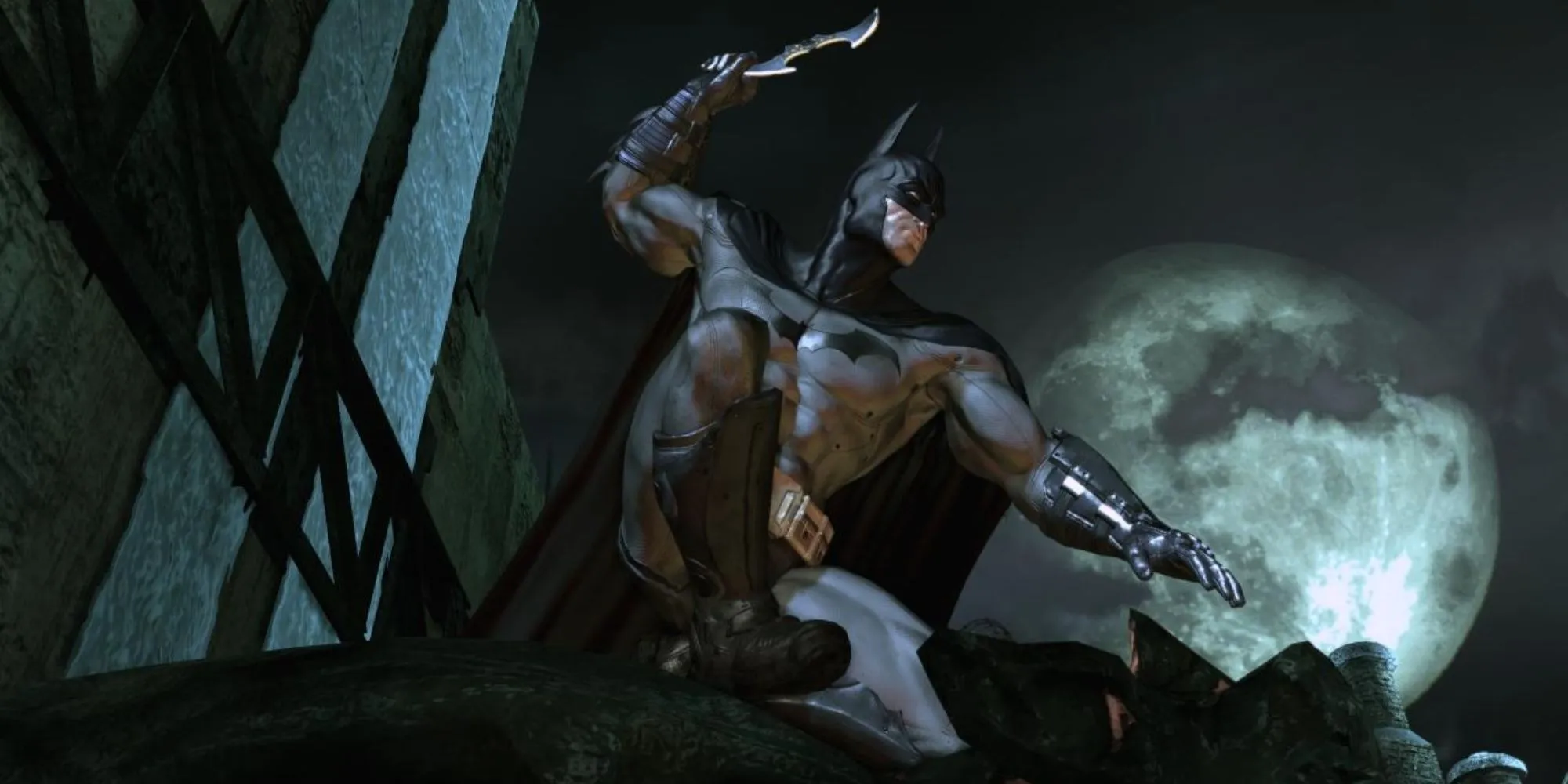Batman đứng trên cao nhìn xuống nhà thương điên Arkham trong Batman Arkham Asylum