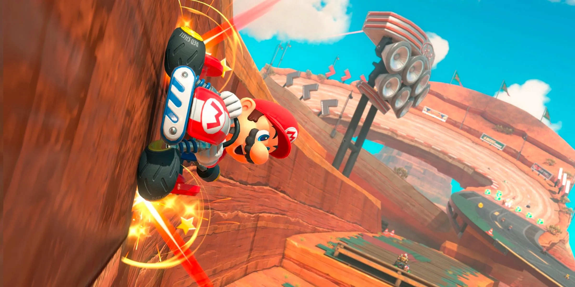 Mario lái xe trên tường trong đường đua Mario Bros. Circuit trong Mario Kart World.