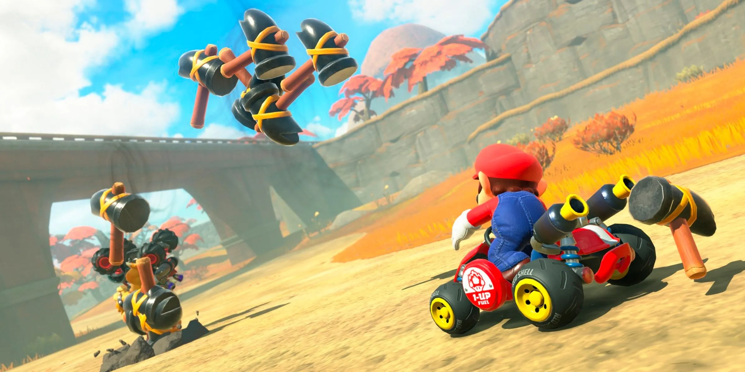 Mario sử dụng item Búa tấn công Bowser trong Mario Kart World.